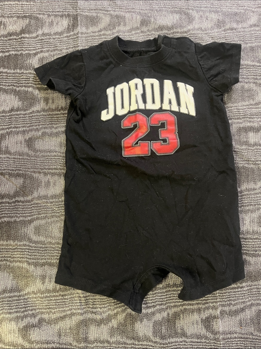Jordan Black Short Sleeve 0-6 months onesie with Red 23 and White Logo